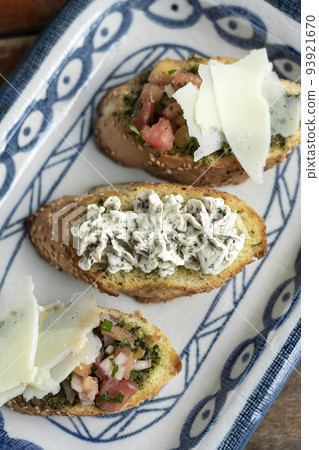 pinchos tapas with Bruschetta and creamed herb cheese on toast 93921670