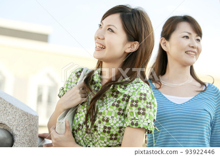 Mother and daughter looking far away 93922446