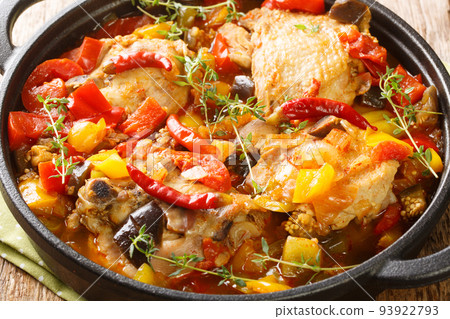 African Ivory Coast Style Kedjenou Chicken Stew with vegetables closeup in the pan. Horizontal African Ivory Coast Style Kedjenou Chicken Stew with vegetables closeup in the pan. Horizontal 93922793