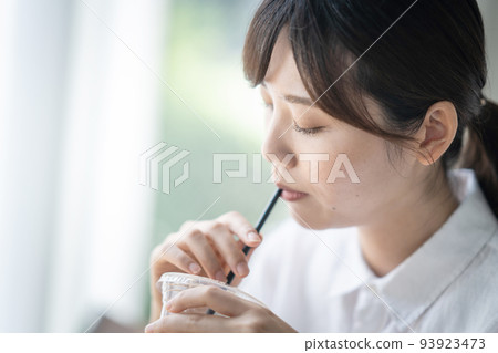 A woman drinking coffee A woman drinking coffee 93923473