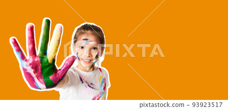 happy little child girl showing hands painted in colorful paint 93923517
