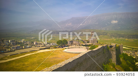 Panoramic view to Gjirokastra castle with the wall, tower and Clock, Gjirokaster, Albania Panoramic view to Gjirokastra castle with the wall, tower and Clock, Gjirokaster, Albania 93924058