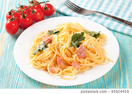 Pasta Carbonara served on a white plate. Pasta Carbonara served on a white plate. 93924459
