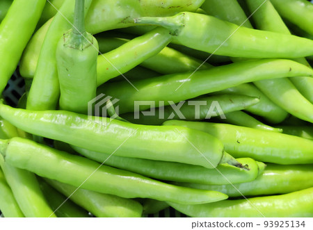 organic fresh green Chili Peppers at fresh opened market, nature ingredient backgrounds organic fresh green Chili Peppers at fresh opened market, nature ingredient backgrounds 93925134