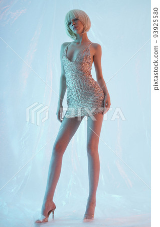 Beautiful sexy blonde in an evening dress Beautiful sexy blonde in an evening dress 93925580