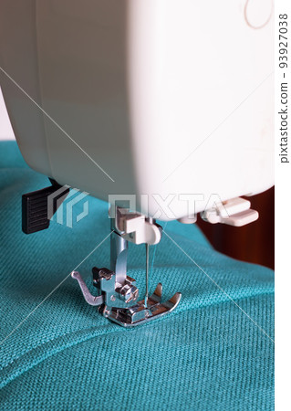 Modern sewing machine and turquoise fabric Modern sewing machine and turquoise fabric 93927038