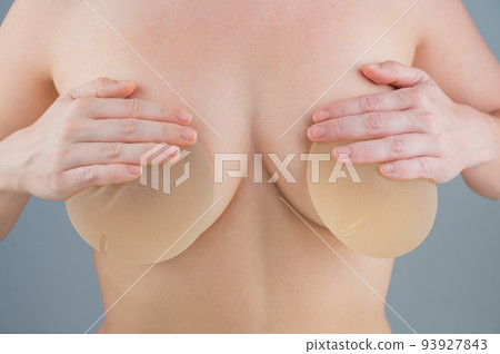 Caucasian naked woman trying on silicone breast - Stock Photo [93927843]  - PIXTA