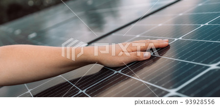 Close up on female hand touching stroking photovoltaic solar panels in sunny day, renewable clean energy power concept Close up on female hand touching stroking photovoltaic solar panels in sunny day, renewable clean energy power concept 93928556