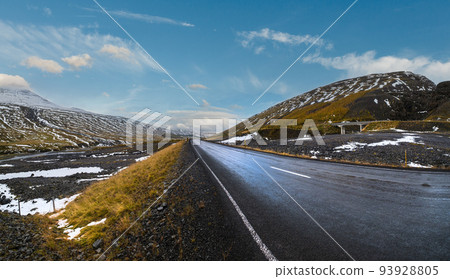 Highway road and mountain view during auto trip in Iceland. Spectacular Icelandic landscape with  scenic nature 93928805