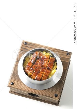 A bird's-eye view of a hot pot rice with grilled eel on a white background A bird's-eye view of a hot pot rice with grilled eel on a white background 93931158