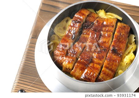 A bird's-eye view of a hot pot rice with grilled eel on a white background 93931174