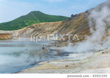 hot mineralized lake with thermal spring and smoking fumaroles in the caldera of the Golovnin volcano on the island of Kunashir hot mineralized lake with thermal spring and smoking fumaroles in the caldera of the Golovnin volcano on the island of Kunashir 93931505