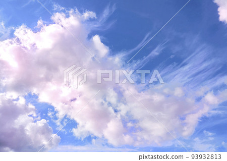 Saturated blue sky with flying pink clouds Saturated blue sky with flying pink clouds 93932813