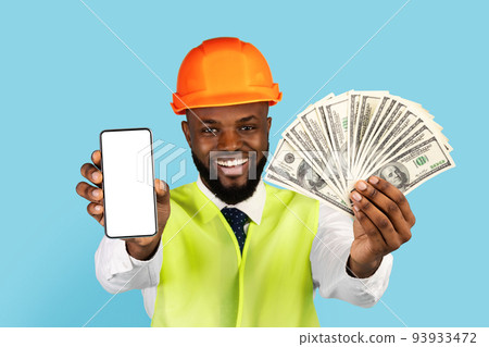 Great Offer. Black Builder Man Demonstrating Money And Blank Smartphone At Camera 93933472