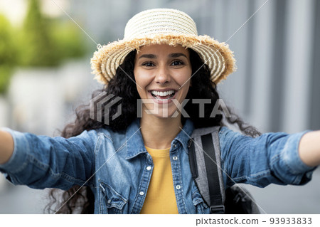 Closeup of happy pretty woman tourist taking selfie Closeup of happy pretty woman tourist taking selfie 93933833