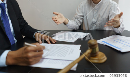 Lawyer and justice concept, Businessman consults senior lawyer for advice on a business contract 93935058