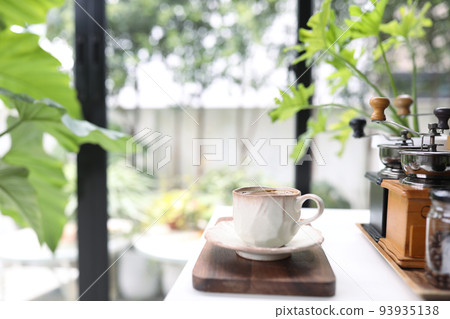Unique coffee cup and coffee utensil on white table indoor 93935138