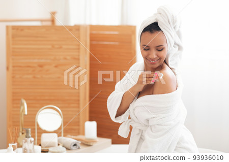 Lady Applying Body Lotion On Shoulders Moisturizing Skin In Bathroom 93936010