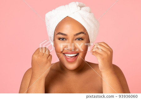 Joyful Black Woman Flossing Teeth Posing Over Pink Background 93936060