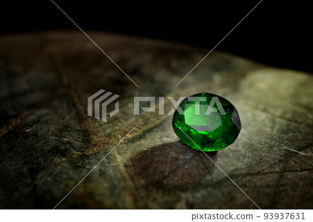 Luxury Emerald Gemstone on Natural Stone 93937631