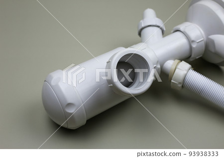 Sanitary set for the sink. Siphon with plastic white pipes for the bathroom Sanitary set for the sink. Siphon with plastic white pipes for the bathroom 93938333