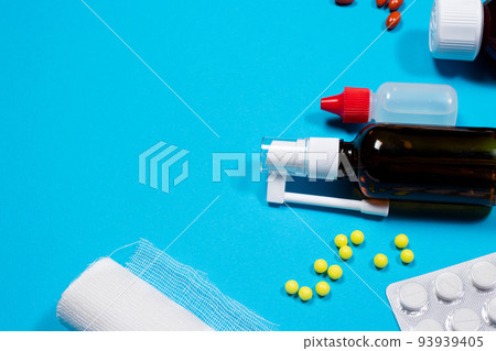 Medical medicines, tablets and jars on a blue background - a layout on a blue background with a place for text. Medicine and Pharmacy Medical medicines, tablets and jars on a blue background - a layout on a blue background with a place for text. Medicine and Pharmacy 93939405