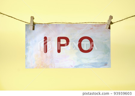 IPO symbols, the concept of an initial public offering of shares on paper in front of a yellow background 93939603