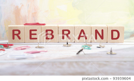 Rebrand and brand symbol. The concept word Rebrand on wooden cubes. Business rebrand and brand concept 93939604
