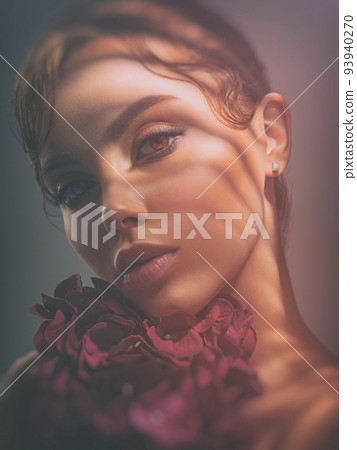Beautiful white girl with purple flowers. Stunning brunette girl with big violet bouquet flowers. Beautiful brunette with hard lines shadows from trafaret paper on her face. 93940270