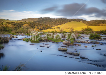 Southern Brazil countryside and river landscape at peaceful sunset Southern Brazil countryside and river landscape at peaceful sunset 93941873
