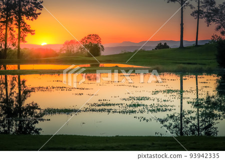 Southern Brazil countryside and lake landscape at peaceful sunset Southern Brazil countryside and lake landscape at peaceful sunset 93942335