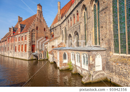 Traditional flemish architecture with Canal Houses of Bruges, Belgium 93942356