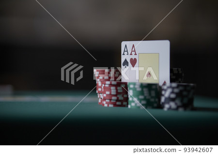the poker game in casino chips cards and the poker table, winning combination in poker, flush royal 93942607