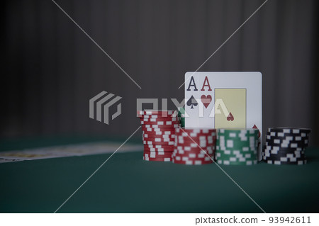 the poker game in casino chips cards and the poker table, winning combination in poker, flush royal 93942611