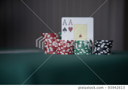 the poker game in casino chips cards and the poker table, winning combination in poker, flush royal 93942613