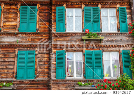 Wooden rustic swiss chalet facade in Interlaken, Switzerland 93942637