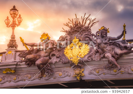 Golden sunrise and nymphs in Pont Alexandre III, Paris, france 93942657