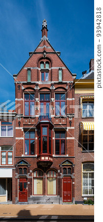 Groningen, The Netherlands - Historical facade against blue sky in old town 93942818