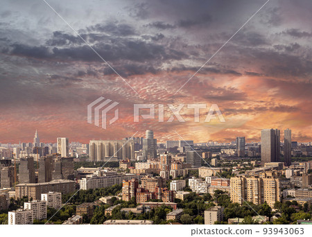 Aerial view of center of Moscow against the background of a romantic evening sky with clouds and rays of the sun, Russia 93943063