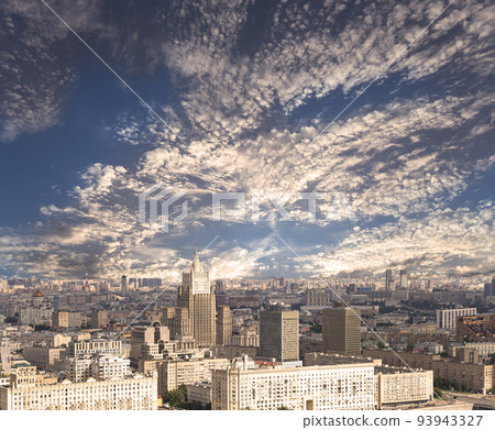 Aerial view of center of Moscow against the background of a romantic evening sky with clouds and rays of the sun (building Ministry of Foreign Affairs), Russia 93943327