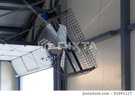 large industrial fan for airing on a modern dairy farm large industrial fan for airing on a modern dairy farm 93945127