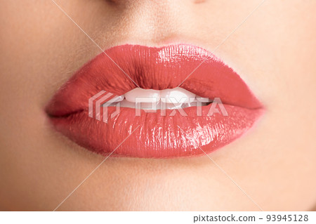 Close-up Beautiful lips. Sexy plump lips which lipstick. Close-up Beautiful lips. Sexy plump lips which lipstick. 93945128