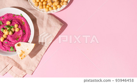 Beetroot hummus on pink background, top view and copy space Beetroot hummus on pink background, top view and copy space 93946458
