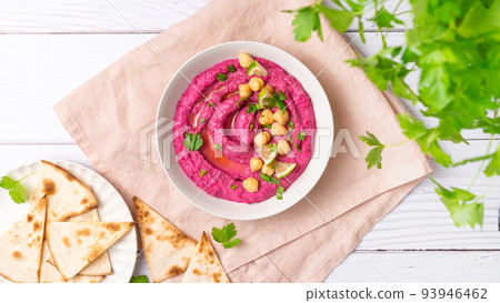 Beetroot hummus on white table, top view Beetroot hummus on white table, top view 93946462