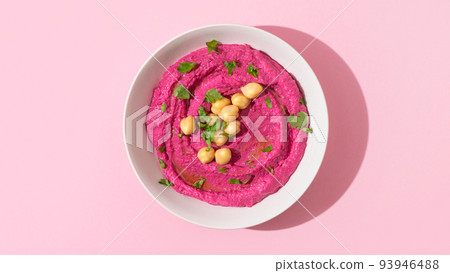 Beetroot hummus on pink background, top view Beetroot hummus on pink background, top view 93946488