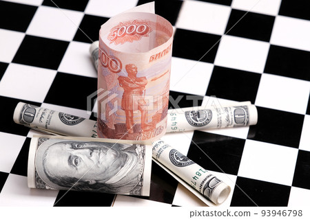 Russian rubles and American dollars on a chessboard 93946798