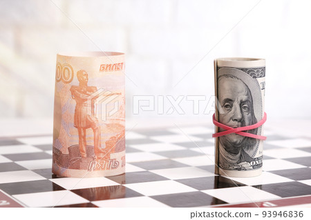 Russian rubles and American dollars on a chessboard Russian rubles and American dollars on a chessboard 93946836