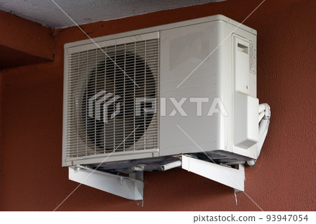 old outdoor air conditioner unit hanging outside the building old outdoor air conditioner unit hanging outside the building 93947054