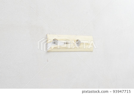 White sockets on a white wall, a socket for a television antenna. 93947715
