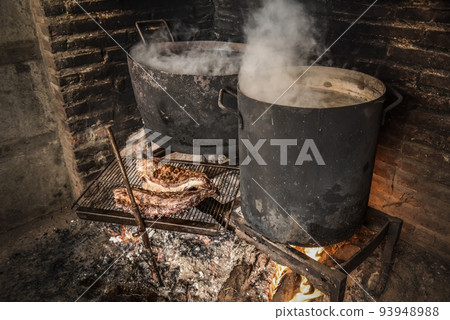 Pig ribbs barbecue , Patagonia, Argentina Pig ribbs barbecue , Patagonia, Argentina 93948988